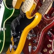 A colorful group of Guy Schwartz guitars