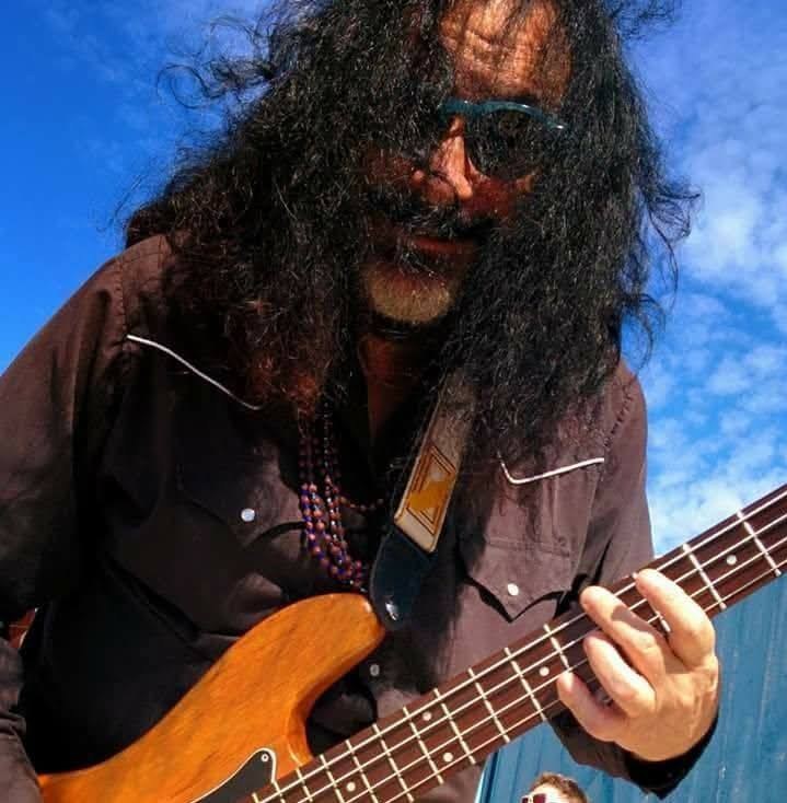 Guy Schwartz playing bass outdoors
